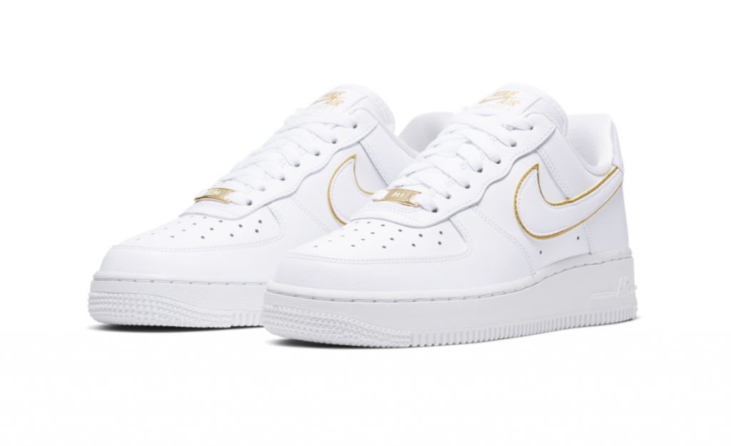 white air forces with gold nike sign